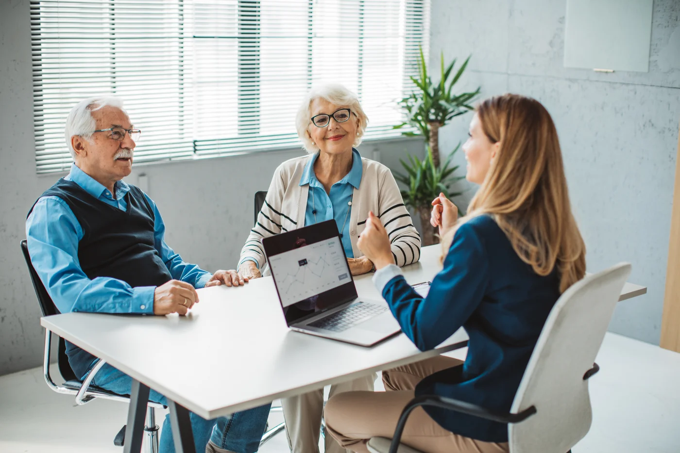 A couple meeting with an adviser to discuss their finances